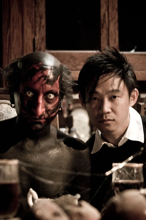James Wan beside the demon character during production